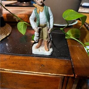 Vintage Figurine with Green Vest and Brown Pants